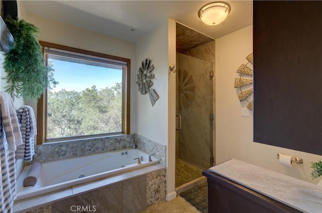 bathroom featuring a stall shower, tile patterned flooring, and a bath