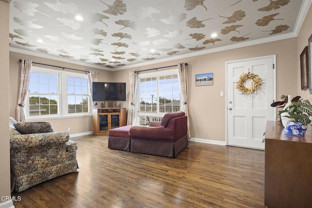 living room featuring wood finished floors, baseboards, and ornamental molding