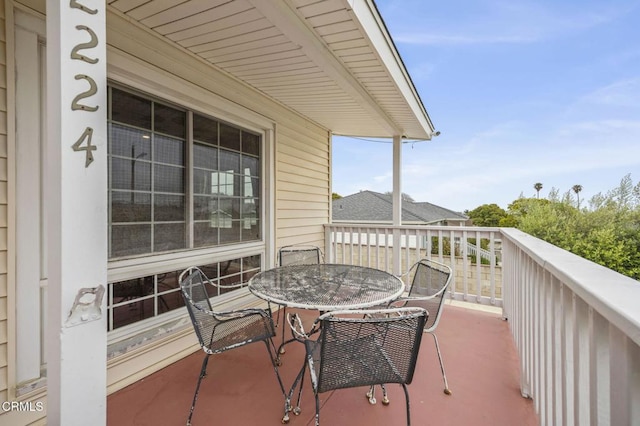 balcony with outdoor dining area