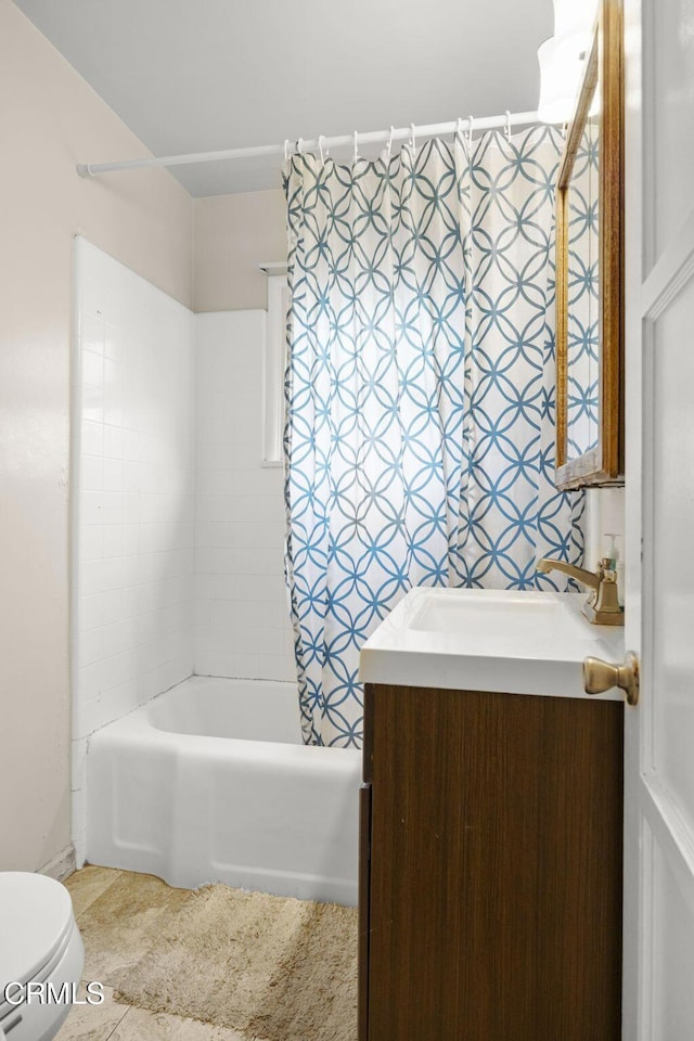 full bathroom with tile patterned floors, toilet, vanity, and shower / bath combination with curtain