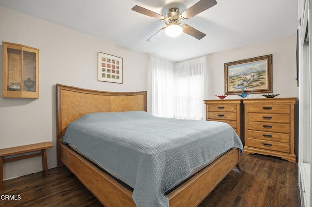 bedroom featuring dark wood-style flooring and a ceiling fan