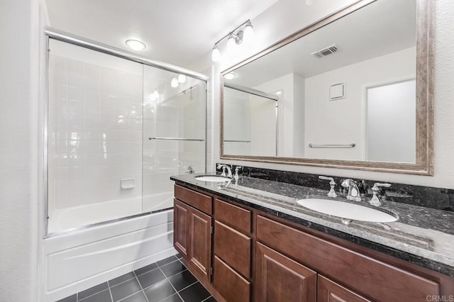 full bathroom with visible vents, a sink, tile patterned flooring, and double vanity