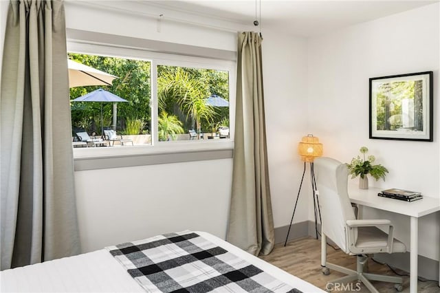 bedroom with wood finished floors