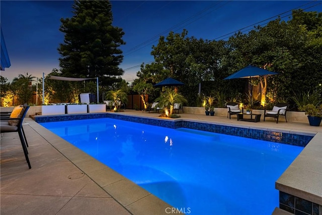 view of pool with a patio, a fenced backyard, and a fenced in pool