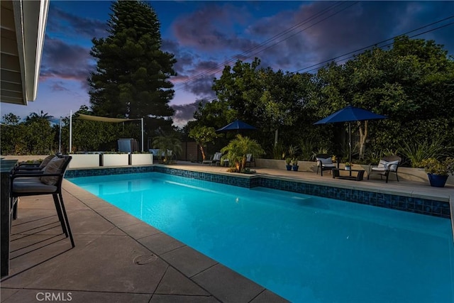 outdoor pool with a patio