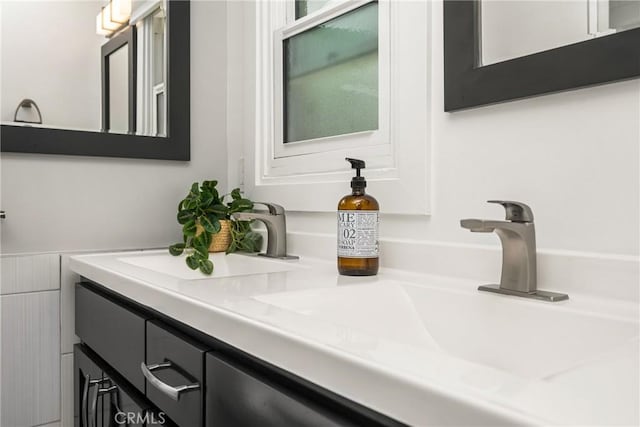 bathroom featuring double vanity and a sink