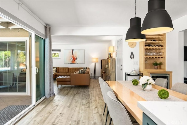 dining area featuring light wood-style floors