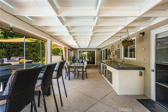 sunroom / solarium featuring a sink