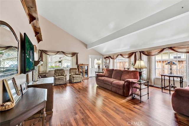 living area with high vaulted ceiling, wood finished floors, and beam ceiling