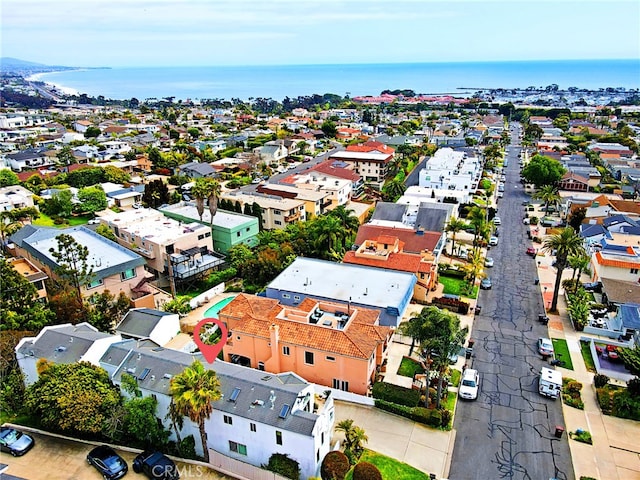 drone / aerial view with a residential view and a water view