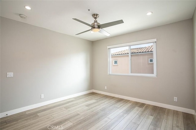 unfurnished room with baseboards, a ceiling fan, wood finished floors, and recessed lighting