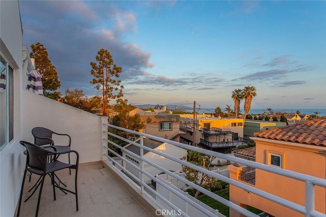 view of balcony at dusk