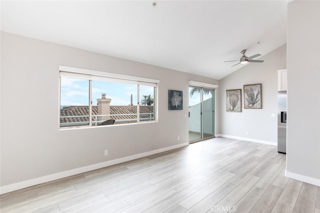 unfurnished room with a ceiling fan, baseboards, a healthy amount of sunlight, and light wood finished floors