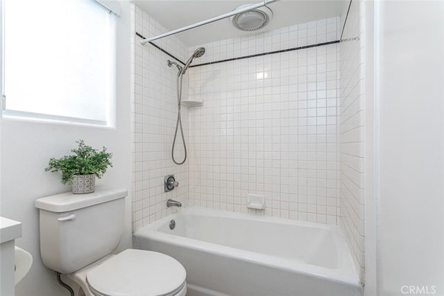 full bathroom with toilet and  shower combination