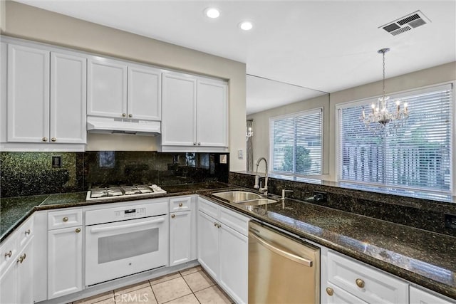 11 Santa Cruz Aisle, Irvine, CA 92606 - kitchen with a sink, under cabinet range hood, visible vents, white cabinetry, and white appliances