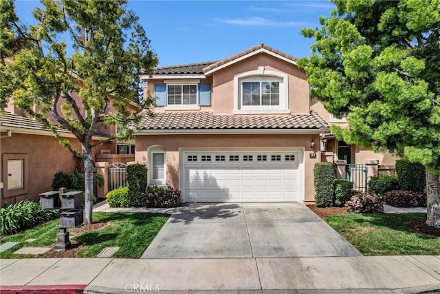 11 Santa Cruz Aisle, Irvine, CA 92606 - view of front of home with stucco siding, fence, a tile roof, driveway, and an attached garage