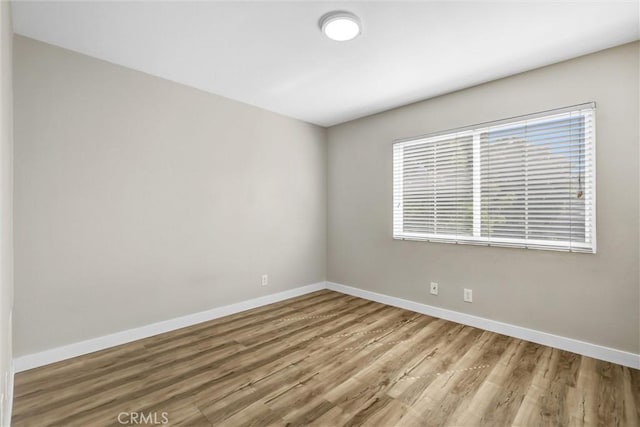 11 Santa Cruz Aisle, Irvine, CA 92606 - unfurnished room featuring wood finished floors and baseboards