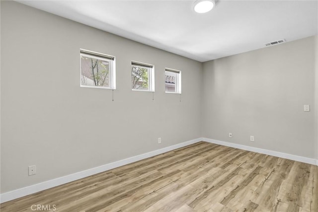 11 Santa Cruz Aisle, Irvine, CA 92606 - unfurnished room with visible vents, light wood finished floors, and baseboards