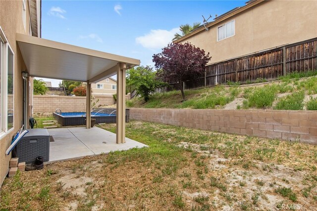 view of yard featuring a patio and a fenced backyard