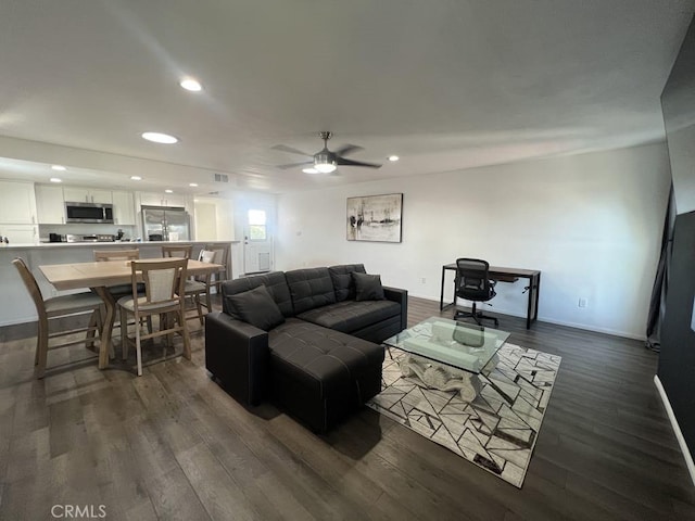 living area featuring visible vents, baseboards, ceiling fan, dark wood-style floors, and recessed lighting