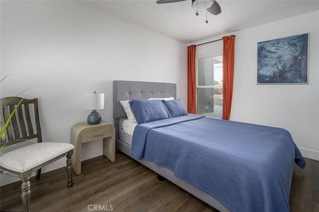 bedroom featuring a ceiling fan and wood finished floors