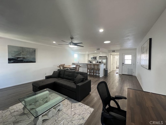 living area with recessed lighting, dark wood-style flooring, and ceiling fan
