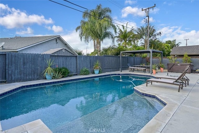 view of swimming pool featuring a hot tub, a patio, a gazebo, and a fenced backyard