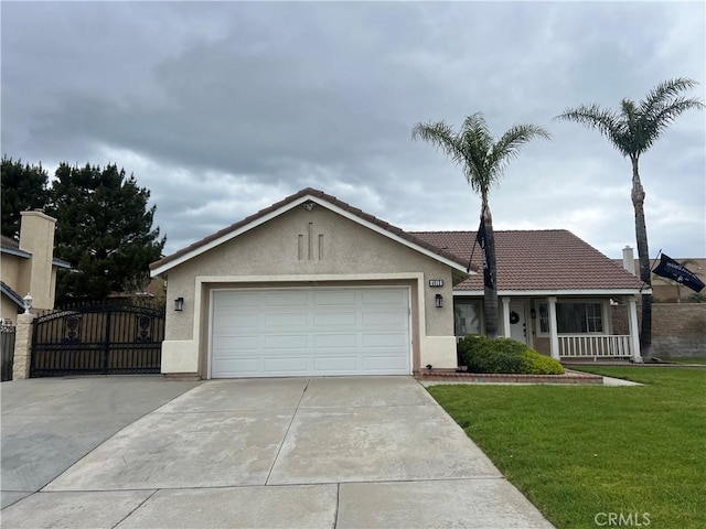 4012 Larkspur Ave, Rialto, CA 92377 - ranch-style home featuring a tiled roof, driveway, a front yard, and stucco siding