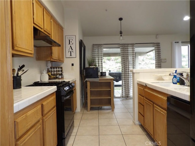 4012 Larkspur Ave, Rialto, CA 92377 - kitchen featuring a sink, black appliances, tile countertops, and under cabinet range hood