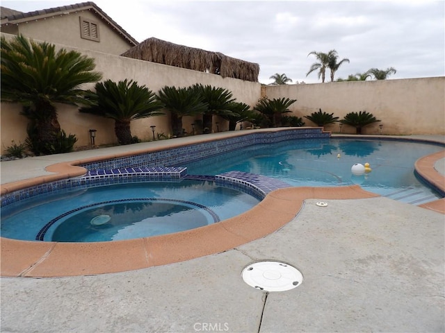 4012 Larkspur Ave, Rialto, CA 92377 - view of pool with a fenced backyard and a pool with connected hot tub