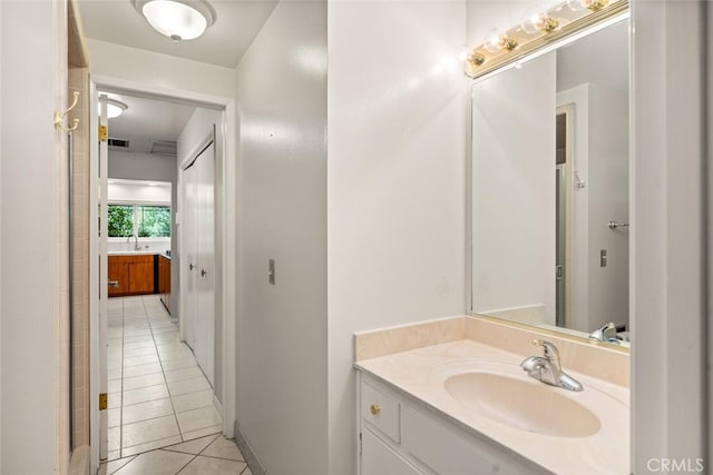 bathroom with tile patterned flooring, visible vents, and vanity