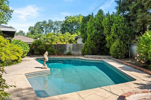 view of pool featuring a patio, a fenced in pool, and a fenced backyard