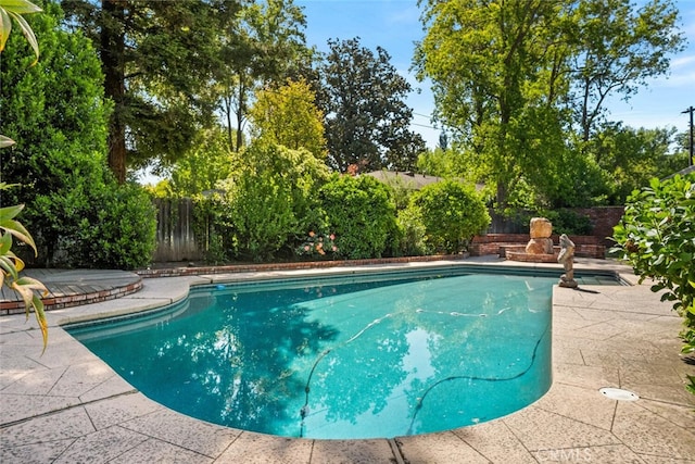 view of swimming pool with a patio, a fenced in pool, and a fenced backyard