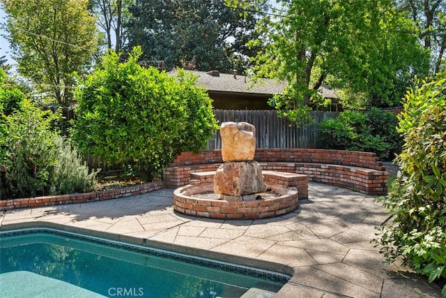 view of swimming pool with fence, a patio, and a fenced in pool