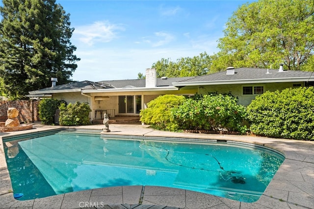 view of swimming pool with a patio and a fenced in pool