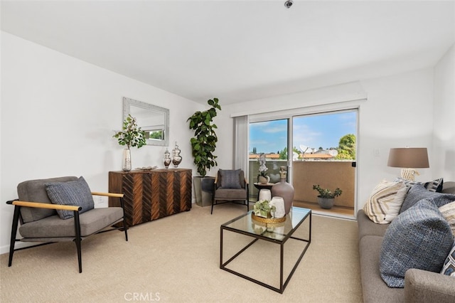 living area featuring light colored carpet
