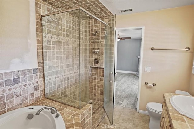 full bath featuring tile patterned flooring, toilet, visible vents, a bath, and a stall shower