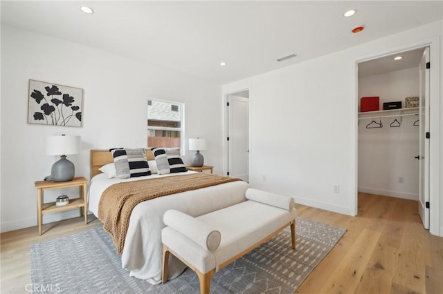 bedroom featuring visible vents, recessed lighting, and light wood-style floors