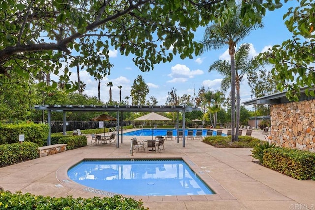 pool featuring fence, a patio area, and a pergola