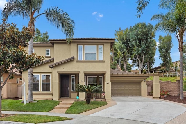 traditional home featuring fence, stucco siding, driveway, and an attached garage