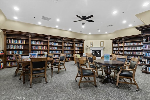dining area featuring carpet floors, a ceiling fan, and recessed lighting