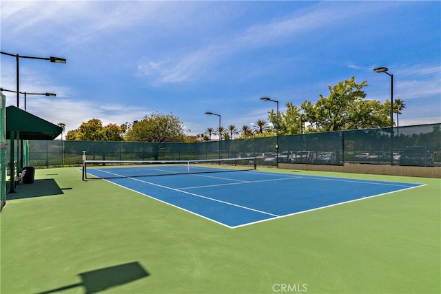 view of sport court with community basketball court and fence