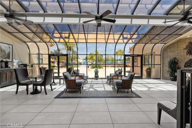 sunroom featuring tile patterned floors and expansive windows