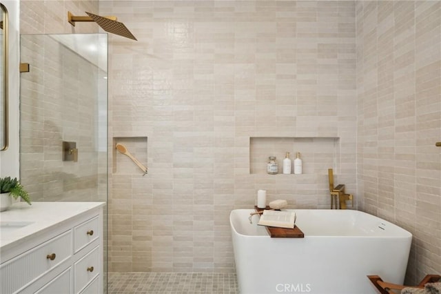 5449 S Victoria Ave, Los Angeles, CA 90043 - full bath featuring tile walls, a walk in shower, a freestanding bath, and vanity