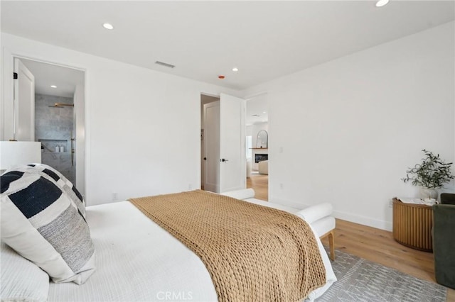 5449 S Victoria Ave, Los Angeles, CA 90043 - bedroom featuring visible vents, recessed lighting, wood finished floors, and baseboards