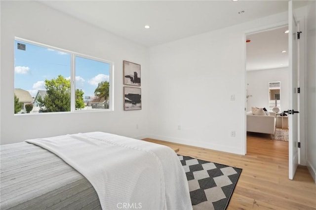 5449 S Victoria Ave, Los Angeles, CA 90043 - bedroom featuring recessed lighting, light wood-style flooring, baseboards, and multiple windows