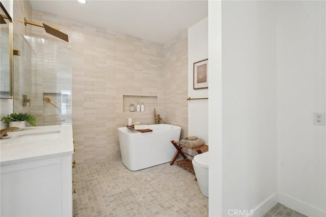 5449 S Victoria Ave, Los Angeles, CA 90043 - full bathroom with tile walls, a freestanding tub, tiled shower, and vanity