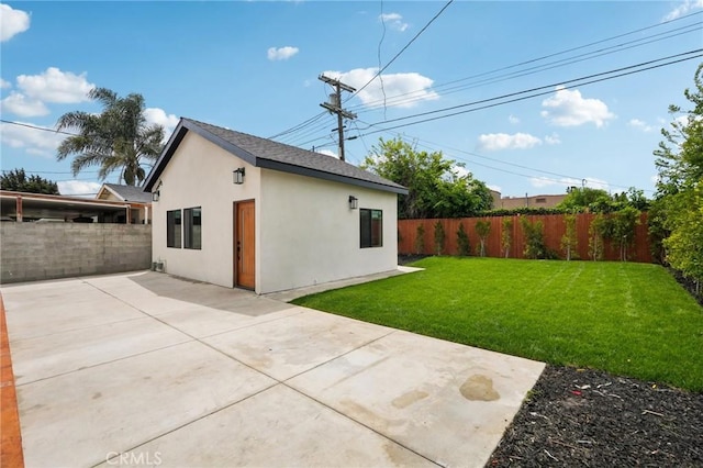 5449 S Victoria Ave, Los Angeles, CA 90043 - exterior space with a patio area, a shingled roof, a lawn, stucco siding, and a fenced backyard