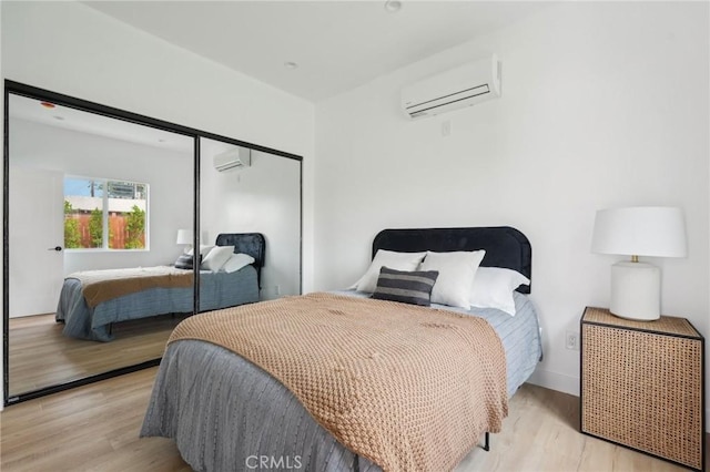5449 S Victoria Ave, Los Angeles, CA 90043 - bedroom featuring a closet, light wood finished floors, and a wall mounted AC