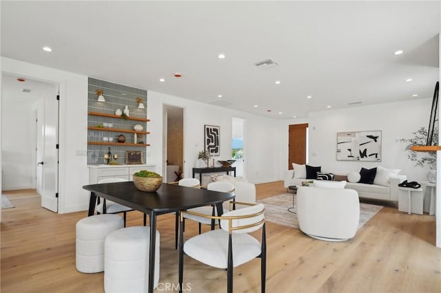 5449 S Victoria Ave, Los Angeles, CA 90043 - dining room featuring recessed lighting, visible vents, and light wood-style floors
